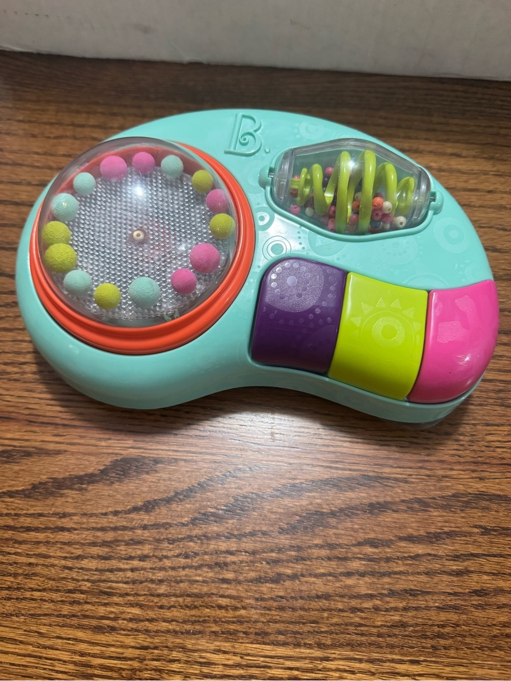 Bright Turquoise Musical Sensory Toy with Pink, Purple & Lime Buttons